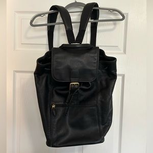 COACH black leather backpack.